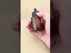 সারমর্মের জন্য সূক্ষ্ম নকশার স্বচ্ছ বাদামী মসৃণ গোলাকার ড্রপার বোতল