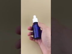 ত্বকের যত্নের জন্য সূক্ষ্ম নকশা পরিষ্কার গাঢ় নীল মসৃণ গোলাকার ড্রপপার বোতল