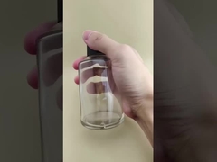 ওষুধের জন্য বিশেষ ঢাকনা সহ সূক্ষ্ম নকশা পরিষ্কার বড় মসৃণ বৃত্তাকার গ্লাস বোতল